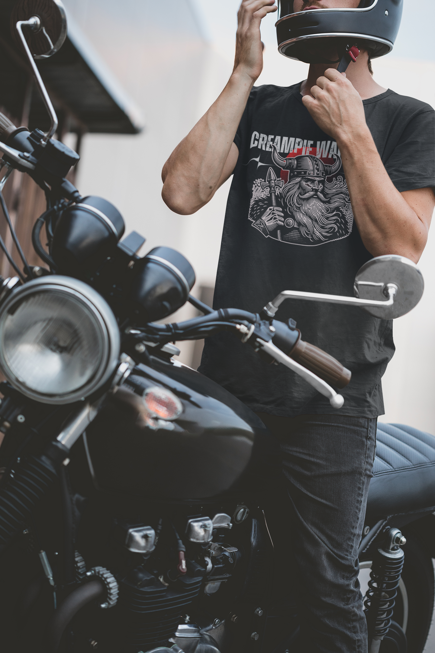 a man standing next to a motorcycle with a helmet on