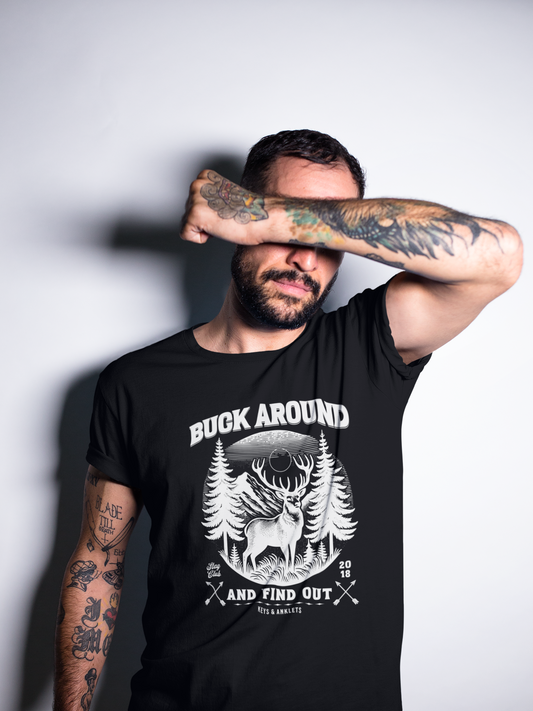 a man wearing a black t - shirt with a deer on it